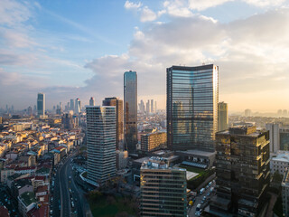 Naklejka premium Istanbul's glass and concrete skyscrapers, home to offices, hotels, and residential complexes. Aerial drone view