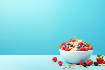 Zelfklevend Fotobehang Healthy cereal bars and berries placed in a bowl on a blue background. © The Big L