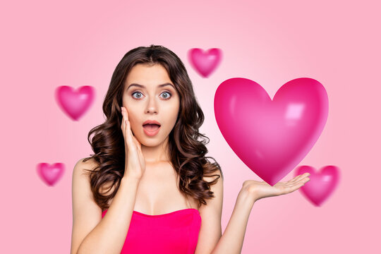 Photo collage image young impressed pretty girl showing demonstrate huge pink heart valentine day love celebration drawing background