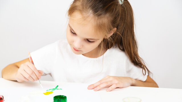 Child drawing. Little girl drawing bright picture. Creative kid playing and studying.