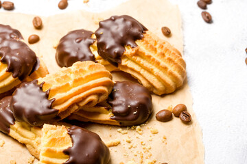 Chocolate shortbread cookies. Light background. Selective focus
