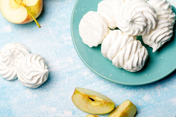 Delicious apple marshmallow. Handmade marshmallows made from applesauce. Flat lay. Blue background