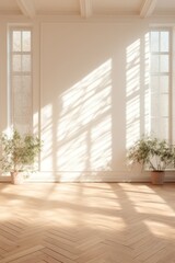 Light ivory wall and wooden parquet floor, sunrays and shadows from window 