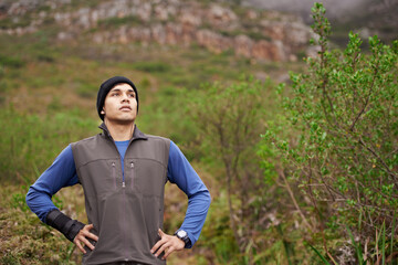 Man, hiking and thinking for adventure, mountain and face for trail, exercise and workout. Hiker, fitness and climber for training, forest and nature to explore, hobby and heart health in outdoors