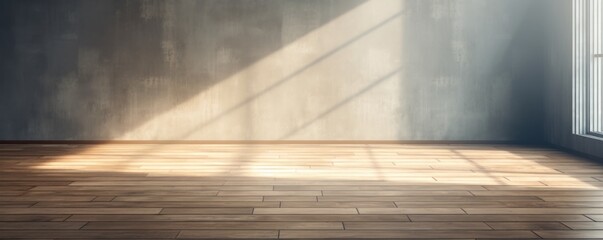Light slate wall and wooden parquet floor, sunrays and shadows from window