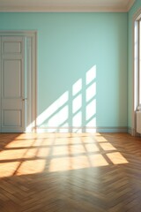 Light turquoise wall and wooden parquet floor, sunrays and shadows from window