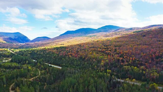 Aerial panning of US route 302 leading to Crawford Notch State park between Mount Webster and Willard. Mt Jackson (left), Willey, Field and Tom (right) are visible in the back.