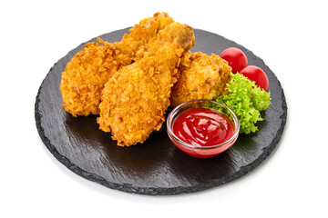 Fried Chicken in breadcrumbs with ketchup, isolated on white background.