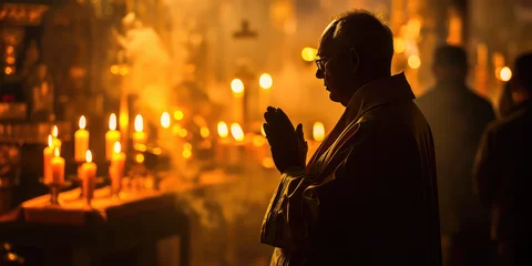 Foto op Plexiglas Mature man in a church prays in a prayer gesture. Man in prayer, church interior. Contemplative Prayer. © dinastya