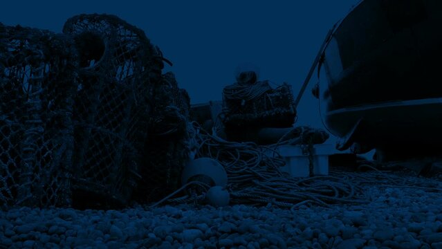 Lobster Pots And Boat On The Shore At Night