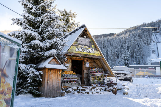 Bacówka, traditional mountain shepherd's hut in Polish Tatra Mountains. Goral shelter converted into small store, selling Oscypki cheese, regional products on January 10, 2024 in Zakopane, Poland.