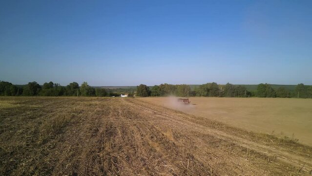 Tractor on the field seeding wheat