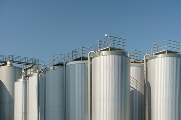 Agricultural silos for storage of grain harvest at an agricultural production farm