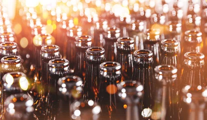 Foto op Plexiglas Banner brewery production line. Conveyor with beer bottles brown glass. © Parilov
