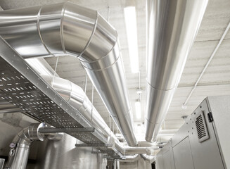 HVAC system pipes, handling heating, ventilation, air conditioning, and cooling, are located on the ceiling. This climate control system ensures the comfort of the rooms in the building.