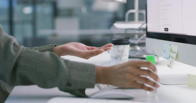 Hands, business person and sanitizer bottle for hygiene, safety or stop risk of bacteria at computer by office desk. Closeup, worker or chemical liquid for cleaning dirt, germs and healthy protection