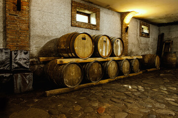 Rustic wooden barrels in the cellar.