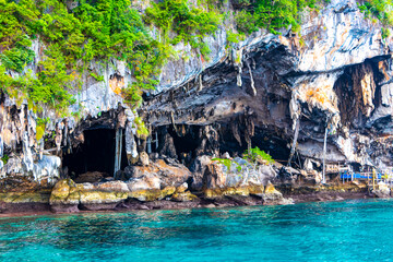Limestone cave and turquoise blue water Koh Phi Phi Thailand.