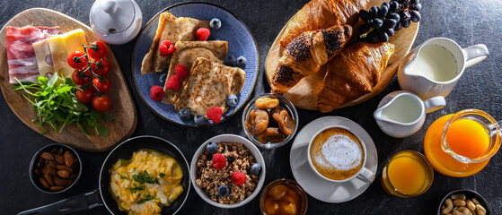 Breakfast served with coffee, eggs, cereals nd croissants