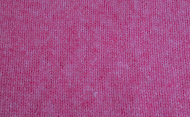Fototapeta premium Pink weißer Grobstrick Woll Pullover aus Alpaca und Mohairwolle zur Hintergrund Nutzung 