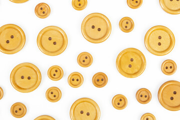 Fototapeta premium White background of wooden round buttons different size