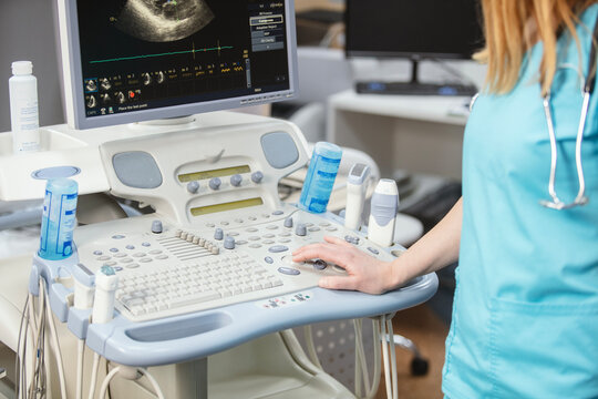 Modern medical equipment in the clinic. An ultrasound machine. Elastography and sonography. Doctor with a modern ultrasound machine, scanners and sensors close-up.