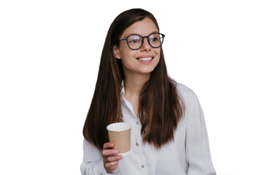 Gorgeous girl in glasses, shirt holding cup of coffee looking at camera, smiling, against transparent background. Successful young businesswoman starting day, looking confidently