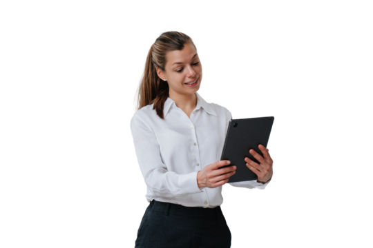Creative young  interior designer holding tablet looking at screen talks with client via internet against transparent background. Beautiful businesswoman