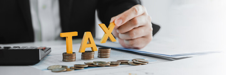 Business TAX plan development for fill in the income tax online return form for payment. Financial research,government taxes and calculation tax return concept.