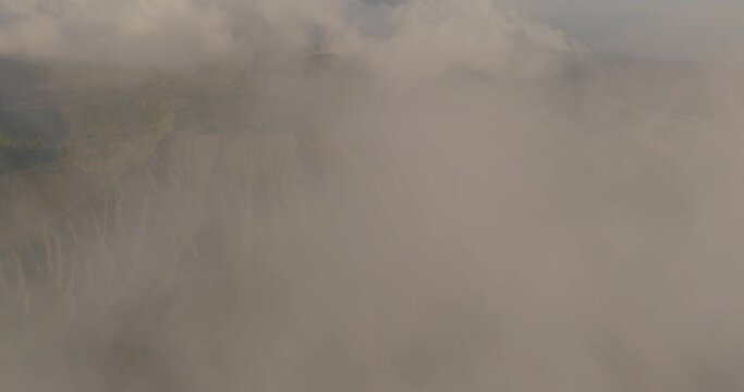 Aerial Idyllic View Of Natural Pattern On Mountain, Drone Flying Forward In Clouds On Sunny Day - Java, Indonesia