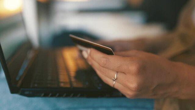 Hands, credit card and laptop for home online shopping, e commerce registration and fintech payment. Person typing on computer with internet banking and subscription on website or financial software