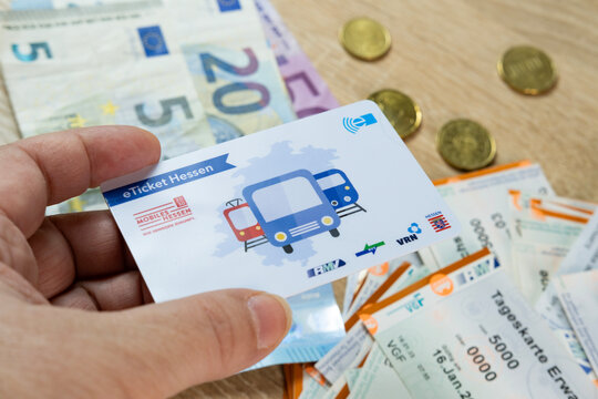female hand holds electronic eTicket Germany, plastic monthly travel card, Digital Transformation in Transit, Public Transportation Technology, Frankfurt - December 3, 2023