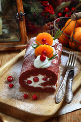 Red velvet roll on wooden background