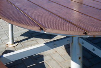 Plastic decking board as a table top for a street cafe table