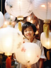 Asian boy holding a paper lantern