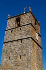 photo background bottom view of the clock tower in the village of Monsanto, Portugal, Europe