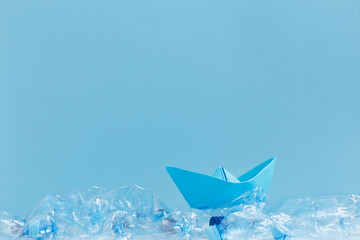 blue paper boat save planet