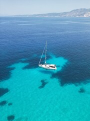 Drone view of the yacht sailing in the Ionian sea near Fteri beach, Kefalonia island, Greece