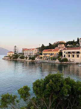 Fiskardo village at sunset time, Kefalonia Island, Greece. Greek Island architecture and yacht harbour