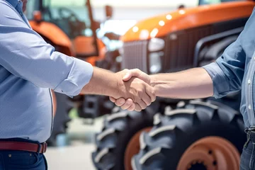 Rolgordijnen Buying new tractor agricultural machine. Close up view of buyer and dealer handshake at tractor dealership. Deal concept.  © BlazingDesigns