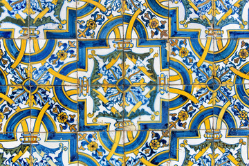 Close up of traditional glazed blue ceramic tiles or azulejos in Portugal