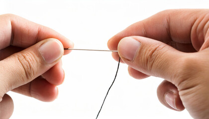 Hand holding a needle and thread