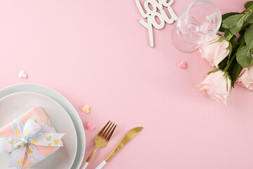 Enchanting Valentine's Day dining experience. Top view shot of plates, cutlery, hearts, gift box,...