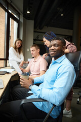Fototapeta premium Smiling man manager of developing company looking at camera