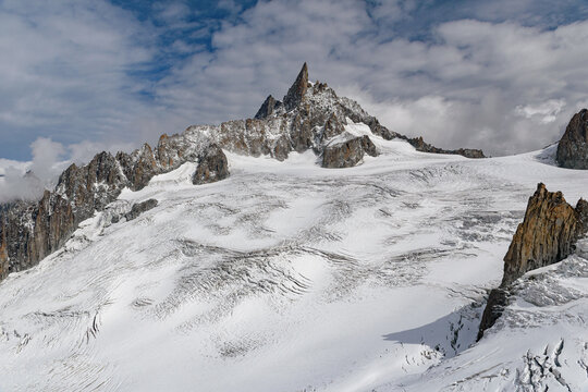 The Geant glacier in the massif of Mont Blanc; in the background the peak of the Dent du Geant