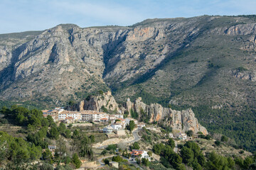 Fototapeta na wymiar View of the medieval Guadalest castle with a part of the fortifications in the tourist town of Guadalest in a mountainous area of the Marina Baixa comarca, in Alicante, Spain