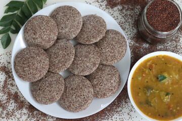 Ragi Idli served with sambhar. A nutritious South Indian staple made with fermented batter of...