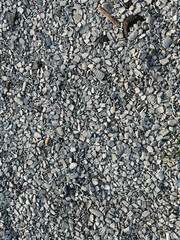 Small road stone background. Gravel pebbles stone texture. Seamless texture