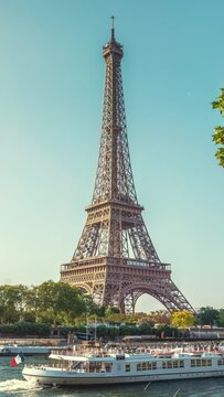 The famous paris eiffel tower in france on a sunny day with sunshine, zoom in camera. vertical video for story and reel