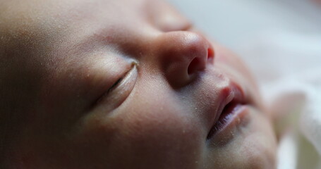 Newborn baby face closeup macro, first day of life